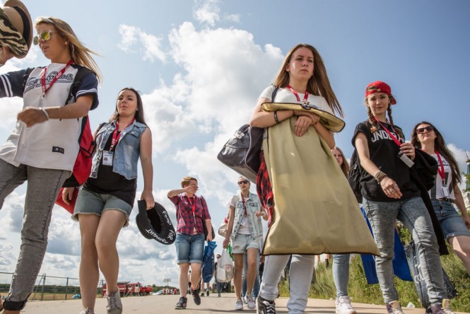 Russian girls walking toward the festival entrance. 