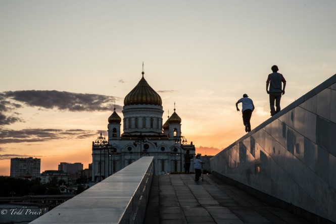 Russian youth skateboarding in central Moscow at sunset. 