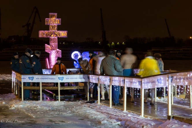 A cross stands next to the ice hole on the Moscow River on the eve of Epiphany.