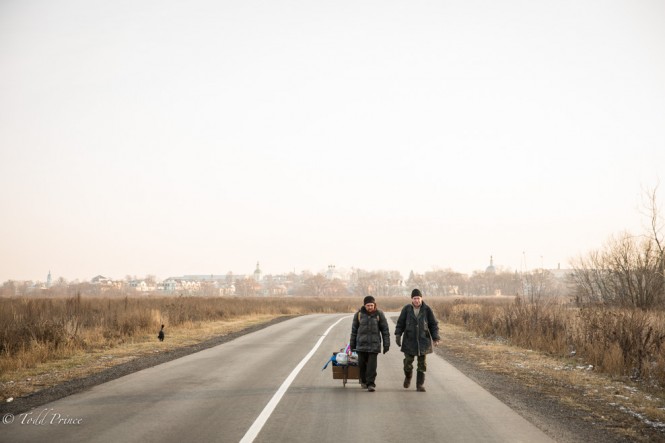 Two men walking toward the Bobrenev Monastery away from the historical part of Kolomna.