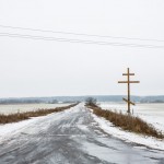 A cross on the side of an icy road in Kursk region.