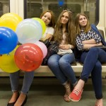 Russian girls, having celebrated a birthday at a restaurant, are taking the train to continue the celebration in the center.