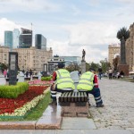 Two city workers taking a rest at a park near Moscow's new Financial Center.