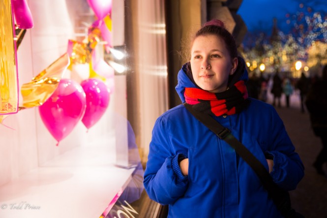Young Moscow girl looking at GUM shopping window. 