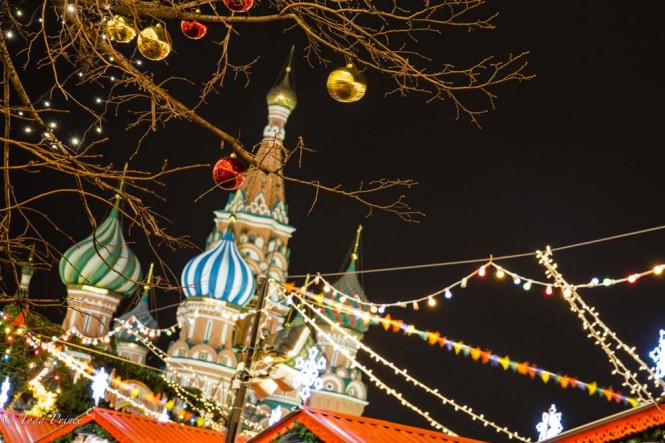 Christmas decorations hang from trees on Red Square. 
