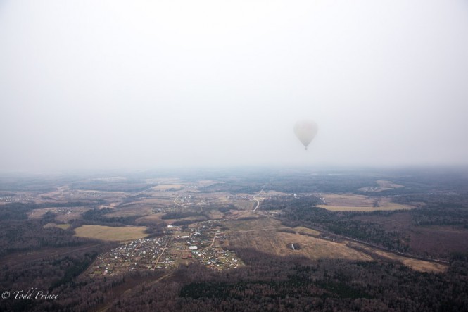 A hot air balloon disappears into the low-hanging clouds. The overcast weather was the biggest drawback of the trip. 