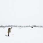 A man catching a fish on Sakhalin.