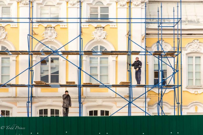 Workers carrying out maintenance on the palace facade at Peterhof. 