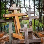 Crosses piled up at the abandoned church in Troitskoe.